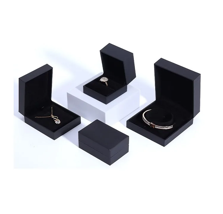 Pure black textured paper ring box with sharp right-angle design wholesale.