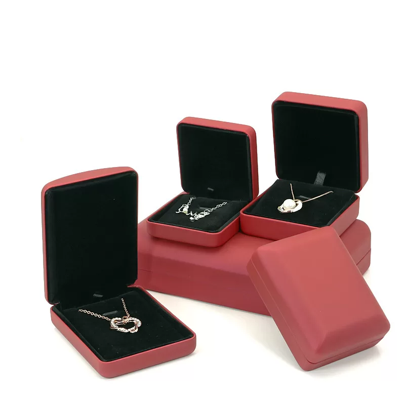 Close up of gold trim detail on red leather jewelry case 029-A