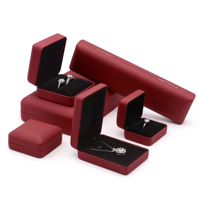 Red leather ring box with metal core open view black velvet interior