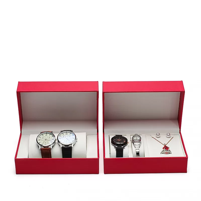 Open view of watch set box holding two watches ring and pendant