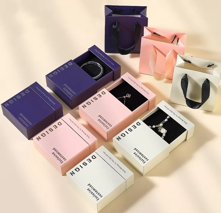 Detail shot of ribbon pull-tab on paper drawer jewelry packaging