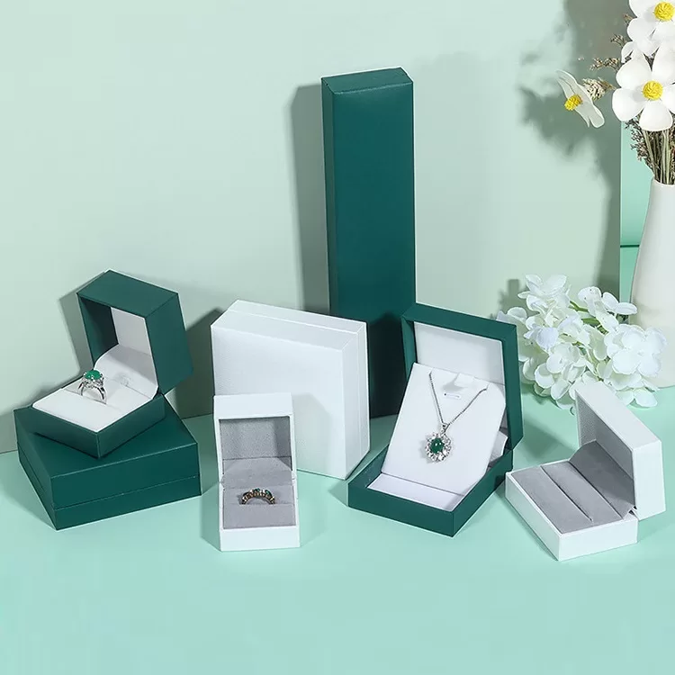 Close up of premium textured specialty paper on green jewelry box.