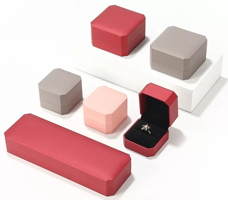 Open view of octagon jewelry box showing matching velvet lining