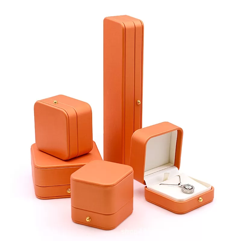 Iconic orange round PU leather jewelry box with gold snap button