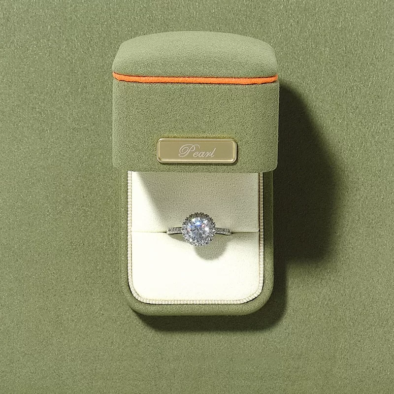 Grass green microfiber ring box with grey trim and gold bar
