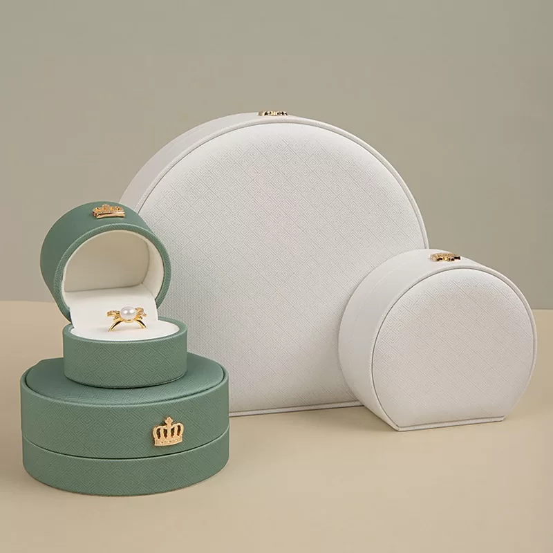 Small half-moon leather ring box with gold crown clasp