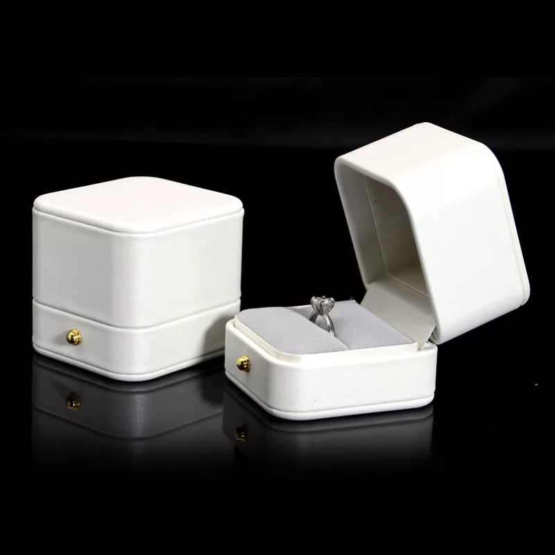 Pure white round PU leather jewelry box with gold snap button for weddings.