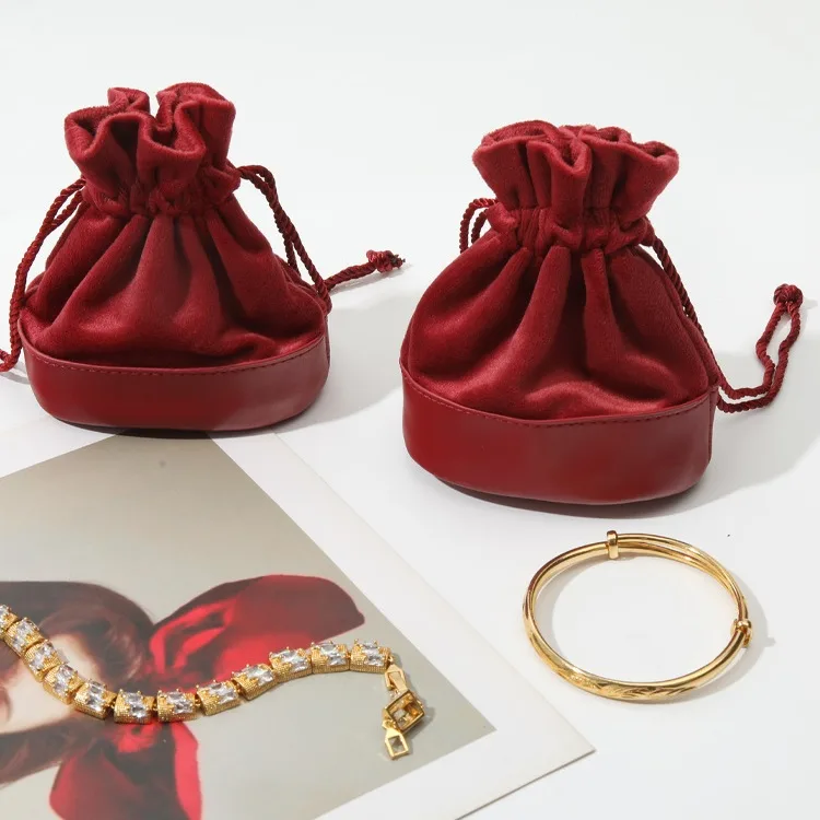 Close up of stitching between velvet upper and PU leather base on jewelry bag