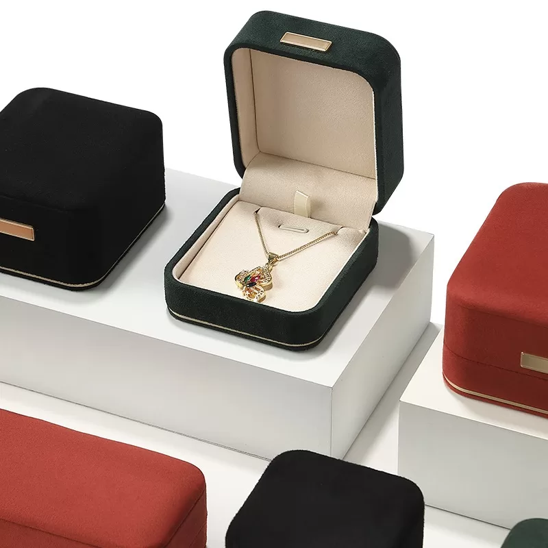 faux suede jewelry box with gold trim,rounded edge faux suede jewelry organizer, soft faux suede jewelry box with rounded design,luxury gold-edged faux suede jewelry case