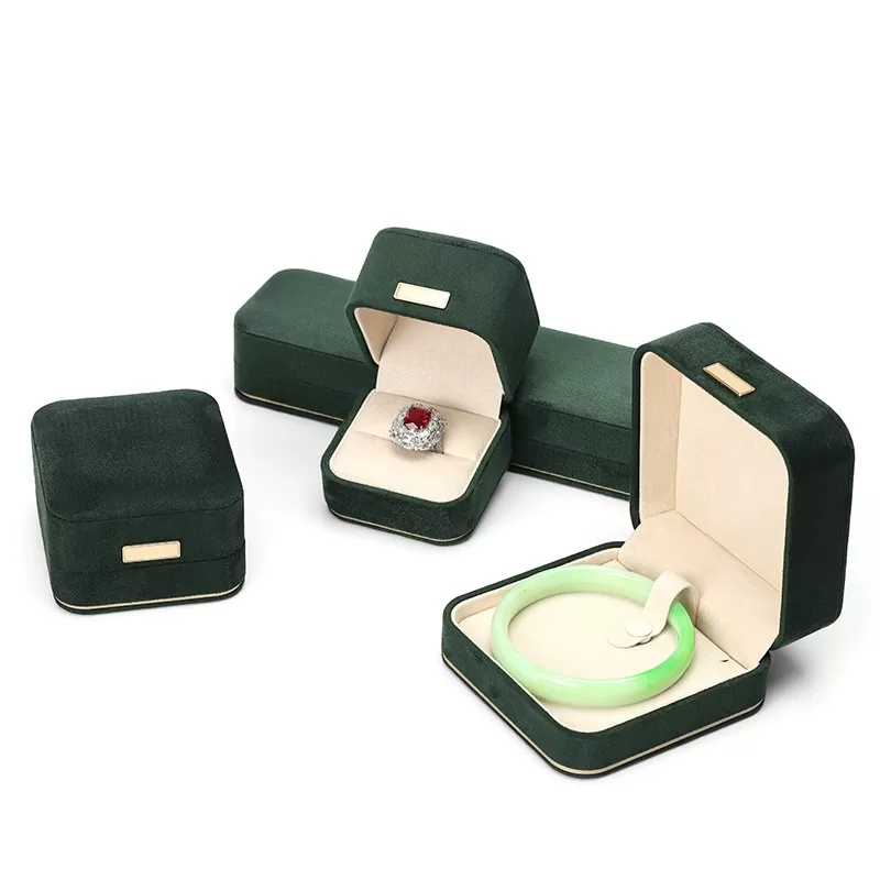 faux suede jewelry box with gold trim,rounded edge faux suede jewelry organizer, soft faux suede jewelry box with rounded design,luxury gold-edged faux suede jewelry case