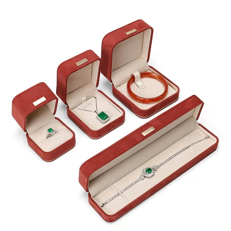 faux suede jewelry box with gold trim,rounded edge faux suede jewelry organizer, soft faux suede jewelry box with rounded design,luxury gold-edged faux suede jewelry case