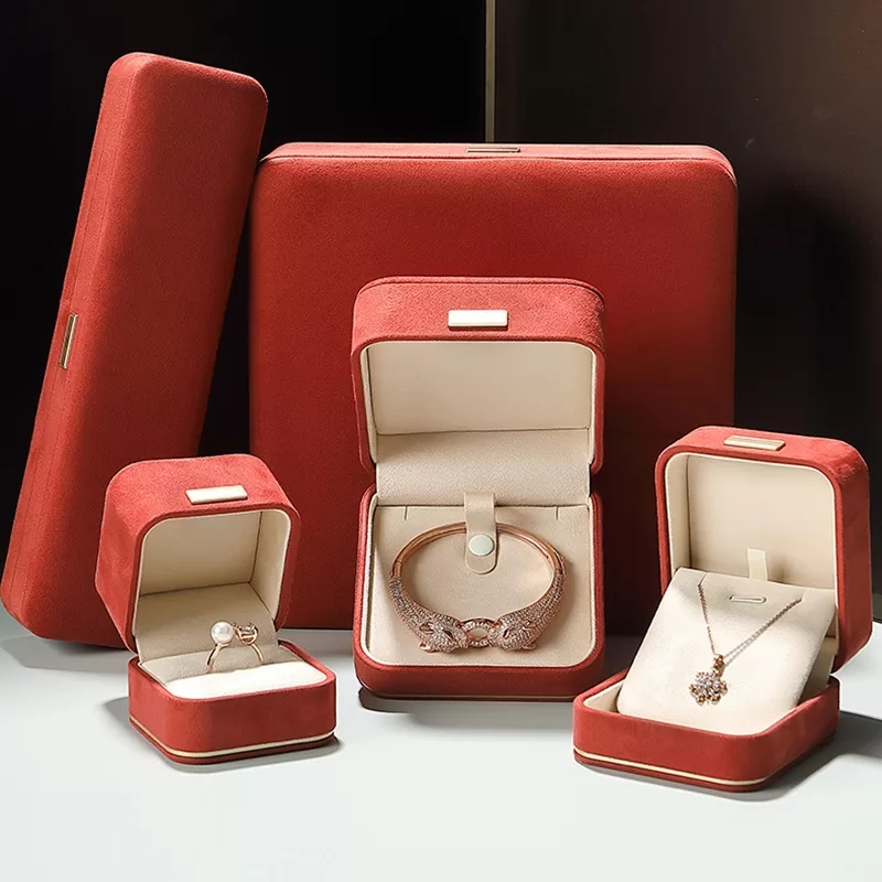 faux suede jewelry box with gold trim,rounded edge faux suede jewelry organizer, soft faux suede jewelry box with rounded design,luxury gold-edged faux suede jewelry case