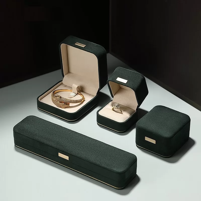 faux suede jewelry box with gold trim,rounded edge faux suede jewelry organizer, soft faux suede jewelry box with rounded design,luxury gold-edged faux suede jewelry case