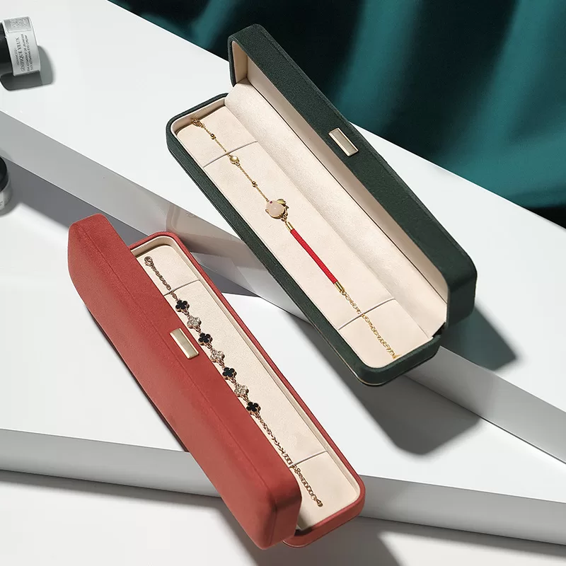 faux suede jewelry box with gold trim,rounded edge faux suede jewelry organizer, soft faux suede jewelry box with rounded design,luxury gold-edged faux suede jewelry case