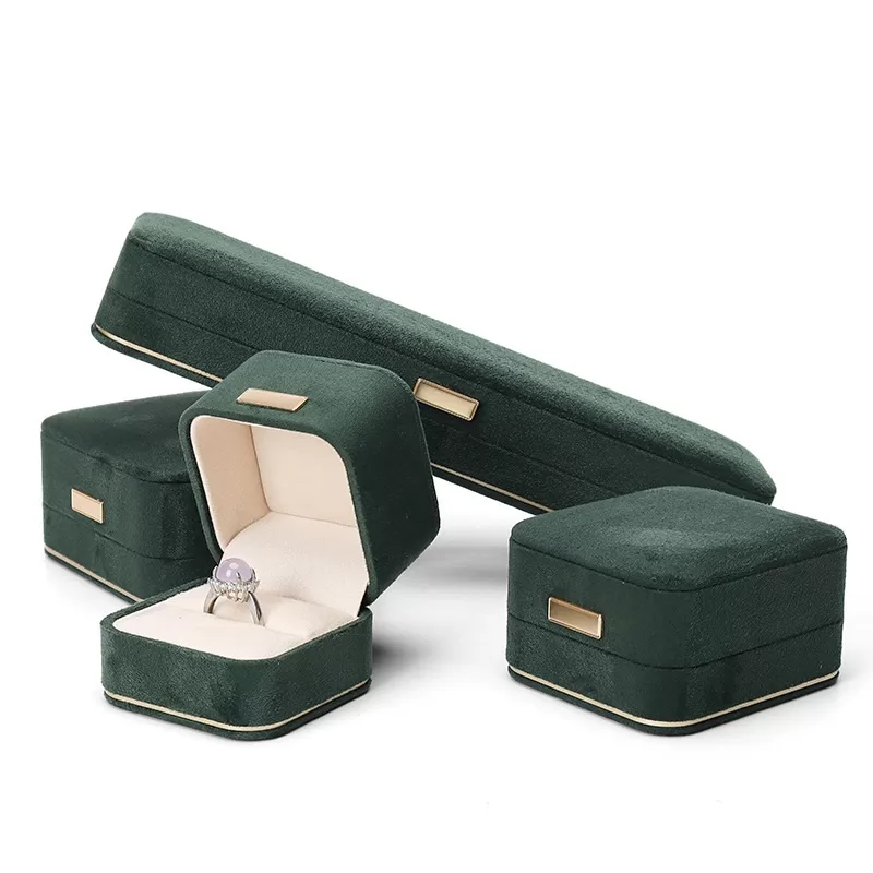 faux suede jewelry box with gold trim,rounded edge faux suede jewelry organizer, soft faux suede jewelry box with rounded design,luxury gold-edged faux suede jewelry case