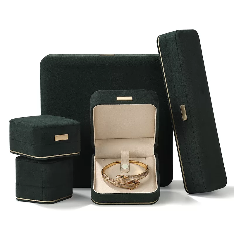 faux suede jewelry box with gold trim,rounded edge faux suede jewelry organizer, soft faux suede jewelry box with rounded design,luxury gold-edged faux suede jewelry case