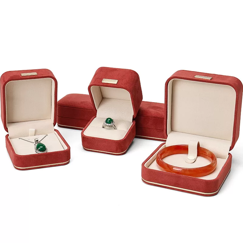 faux suede jewelry box with gold trim,rounded edge faux suede jewelry organizer, soft faux suede jewelry box with rounded design,luxury gold-edged faux suede jewelry case