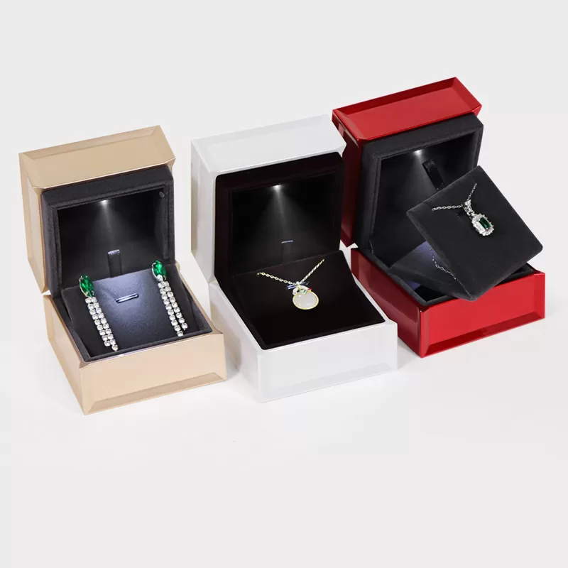 Close up of gold trim detail on high gloss jewelry packaging