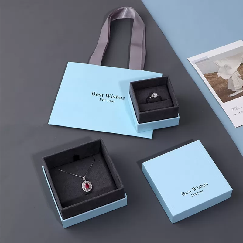 Set of blue rigid paper jewelry boxes in various sizes for retail display