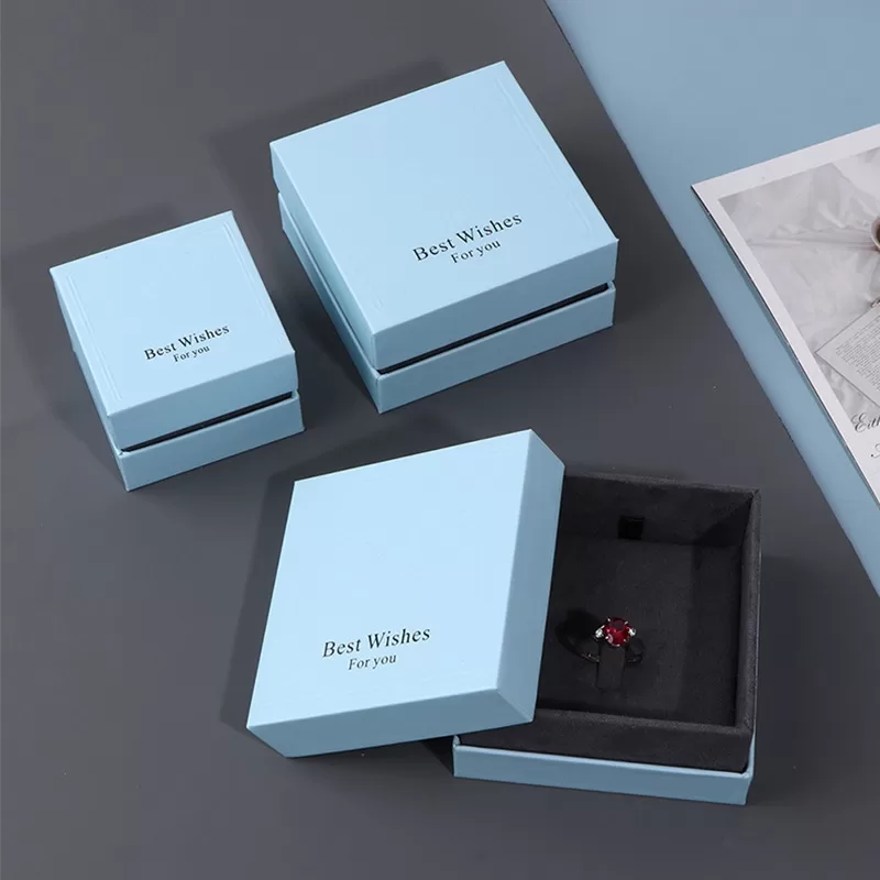 Open view of rigid paper jewelry box with soft velvet insert for rings