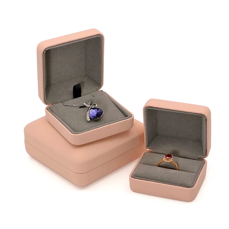 Close up of gold trim detail on pink leather jewelry case