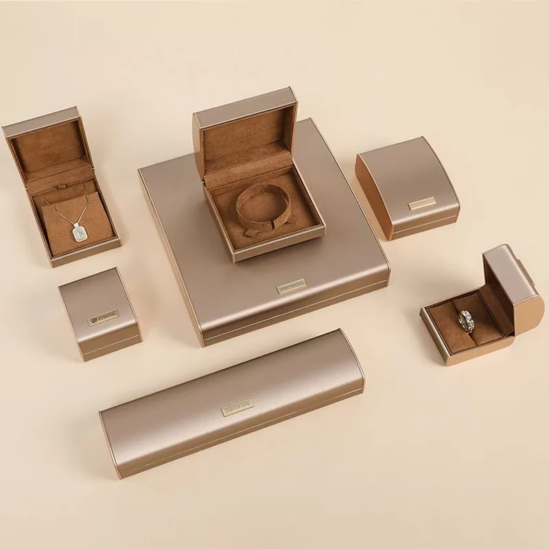 Close up of wire-drawing texture on pink PU leather jewelry packaging.