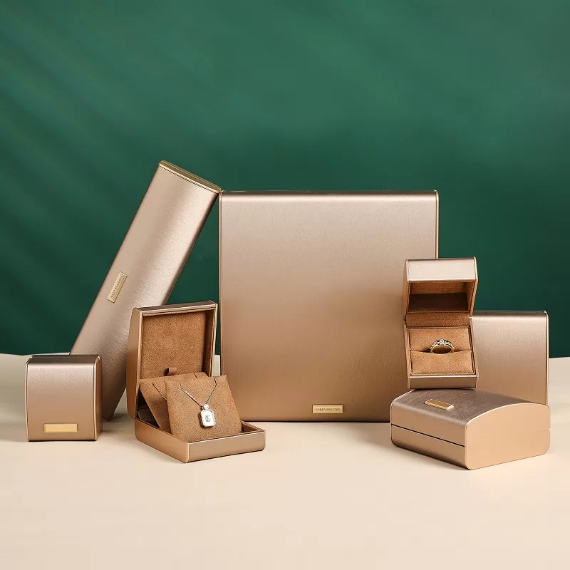 Open arc-shaped rose gold ring box with plush interior.