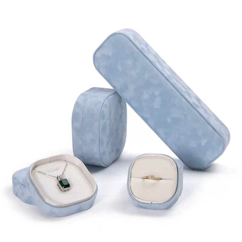 Small oval sky blue velvet ring box for engagement rings