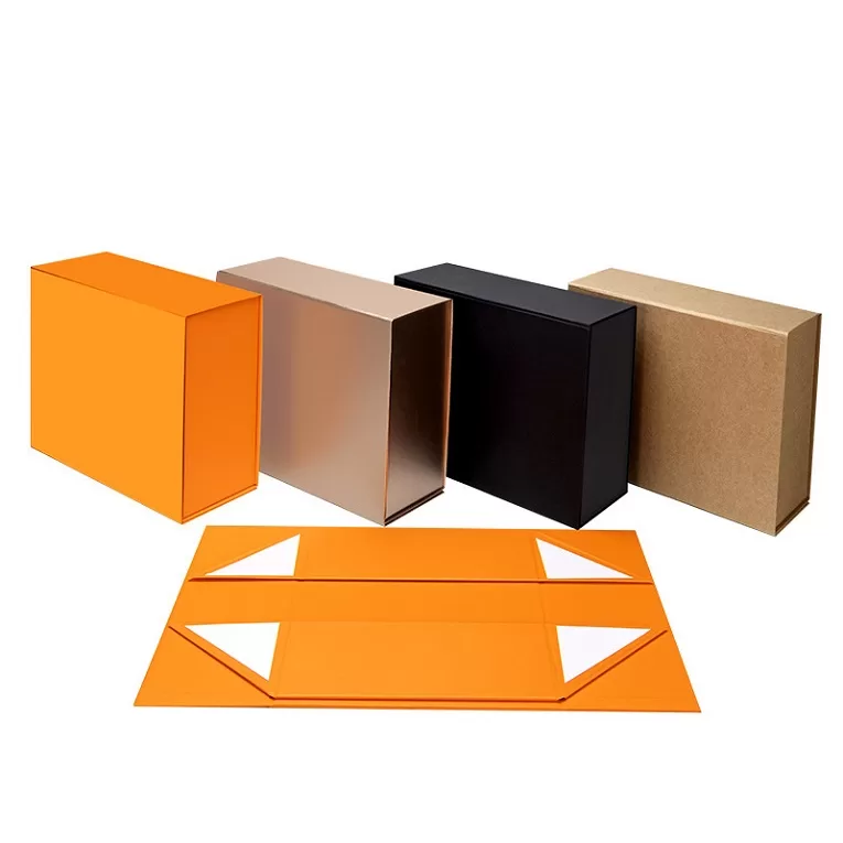 Stack of collapsible rigid cardboard gift boxes flat packed