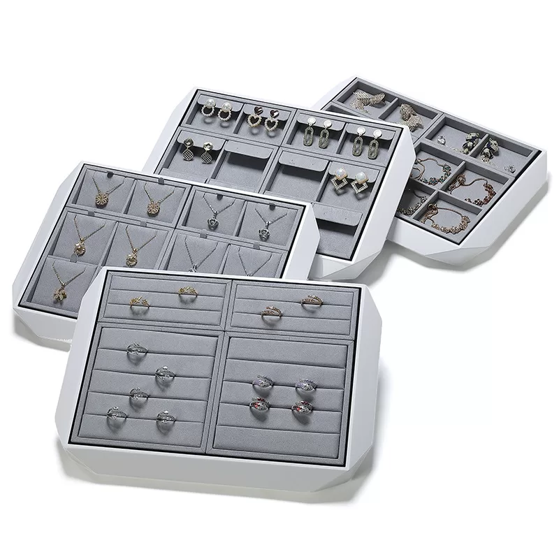 Detail shot of diamond-cut corner on white glossy jewelry presentation tray