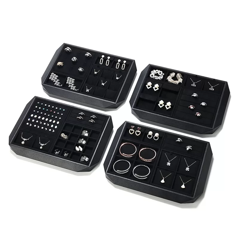 Close up of diamond-cut angled corner on black leather jewelry tray