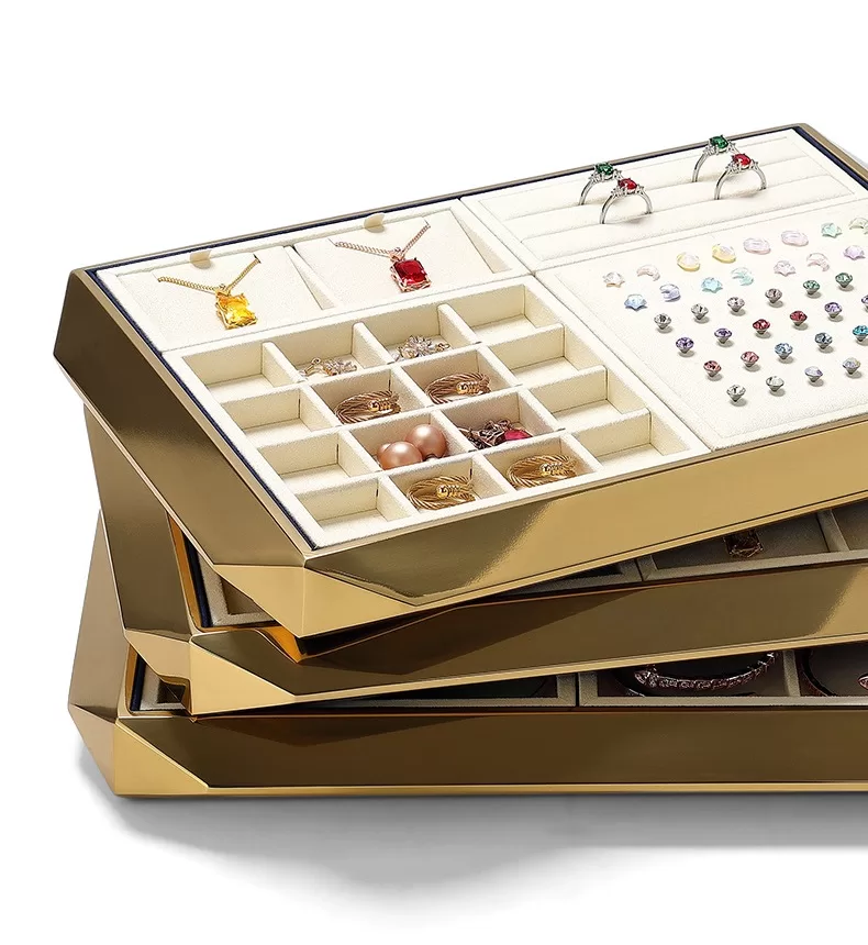 Detail of brushed gold metal finish and angled corner on jewelry tray