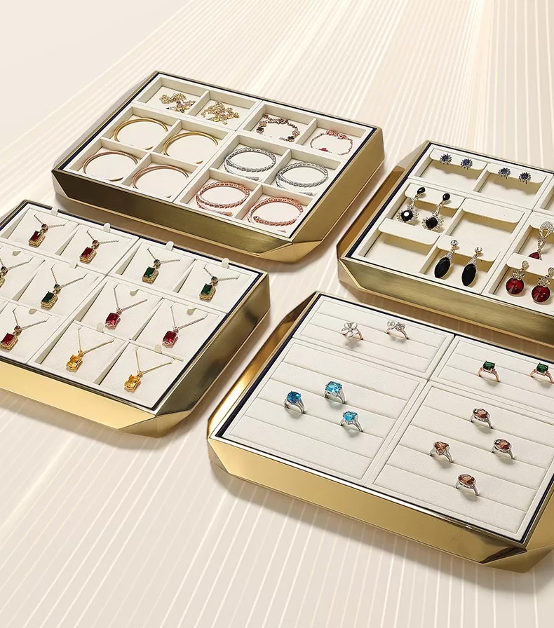 Luxury gold metal jewelry display tray with beige microfiber insert for showroom