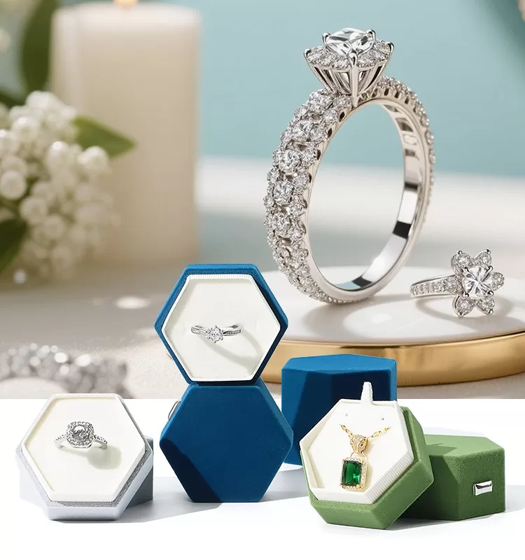 Open view of hexagon double ring box holding engagement and wedding bands