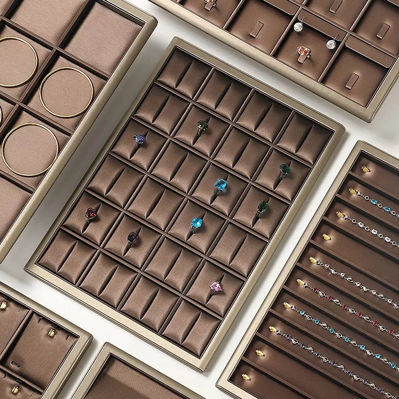 Close up of silky brushed texture on brown jewelry prop