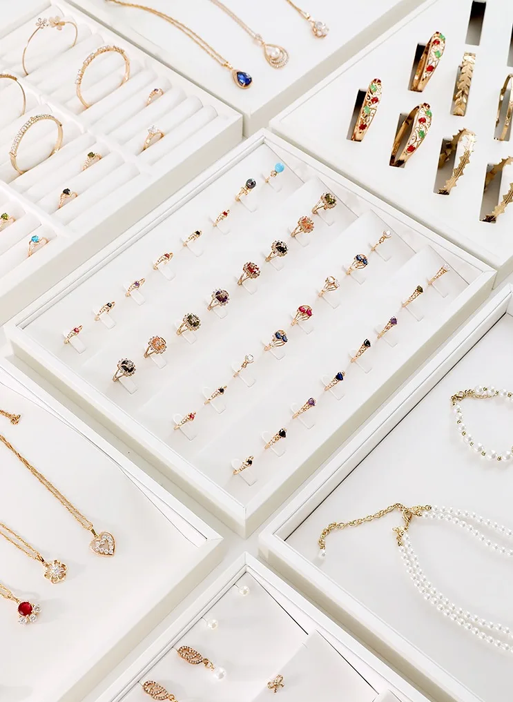 Pure white ring display tray with brushed leather texture